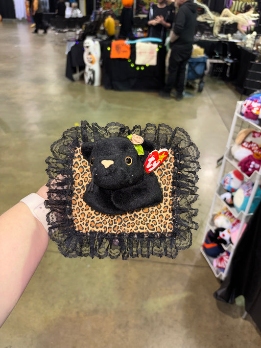 Leopard print, black cat, plush taxidermy 